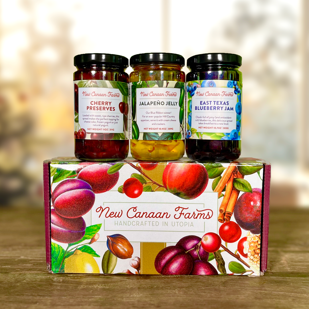 Holiday gift set with three jars of New Canaan Farms preserves, jelly, and jam.