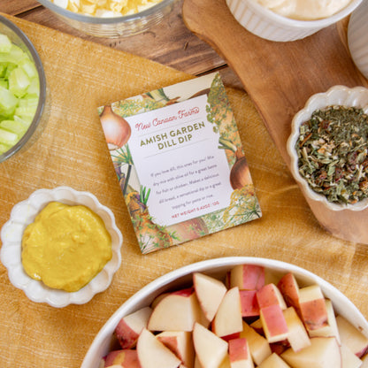 Amish Garden Dill Dip package on a wooden table with apples and other ingredients.