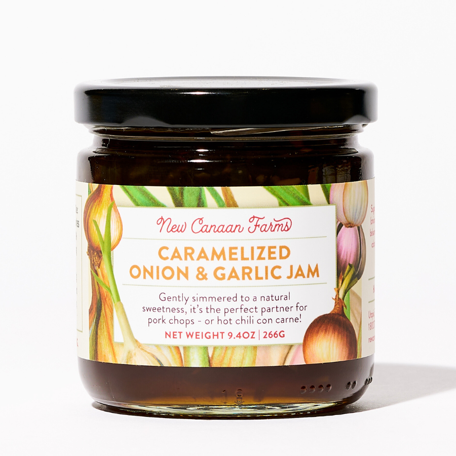 A jar of New Canaan Farms Caramelized Onion & Garlic Jam with an onion and garlic illustrated label