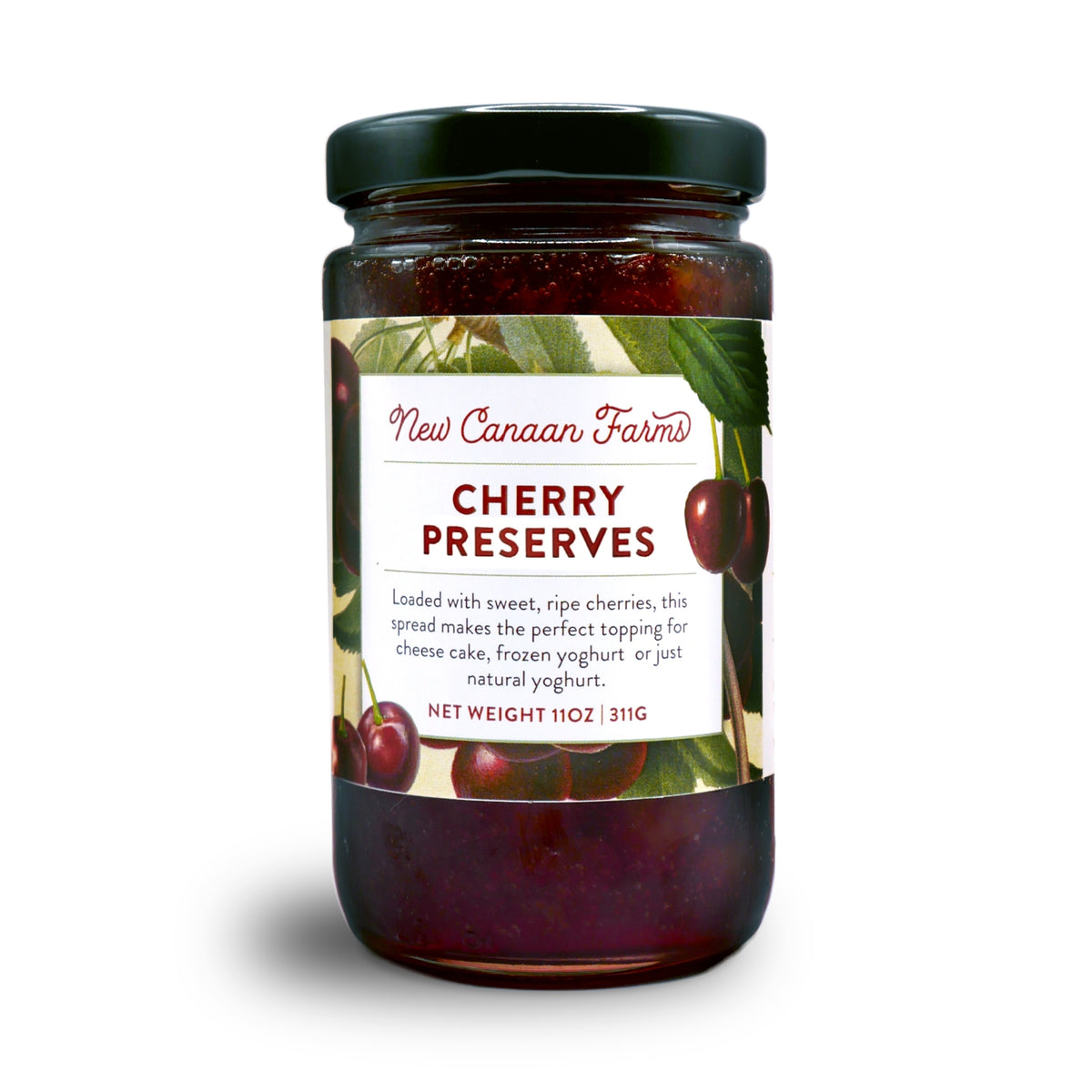 A jar of New Canaan Farms Cherry Preserves on a white background