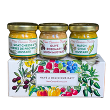 Three jars of mustard on a decorative box with New Canaan Farms branding.