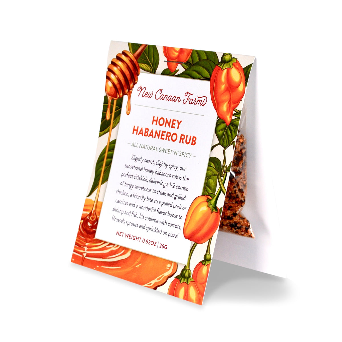 A packet of New Canaan Farms Honey Habanero Rub standing upright with a honey dipper and habanero peppers on the label