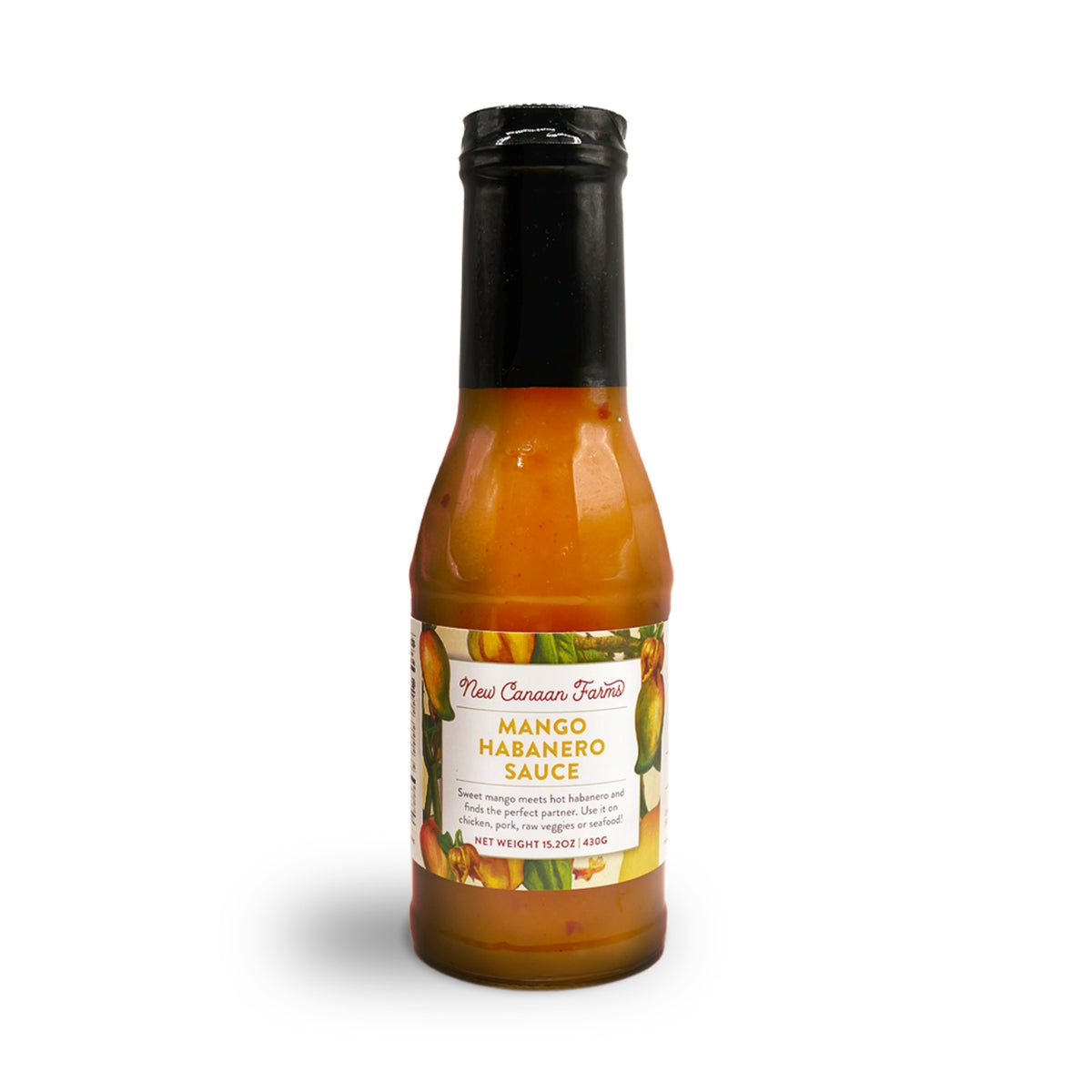 A bottle of New Canaan Farms Mango Habanero Sauce with its label showing