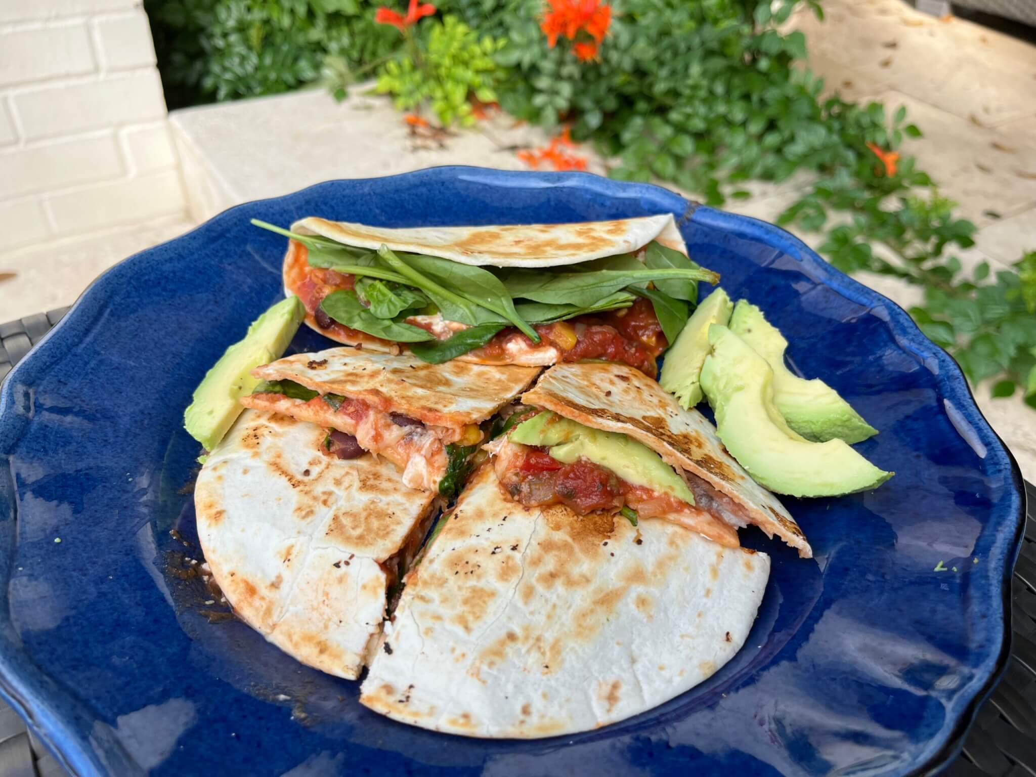 Goat's Cheese, Black Bean and Corn quesadilla on a plate and ready to eat