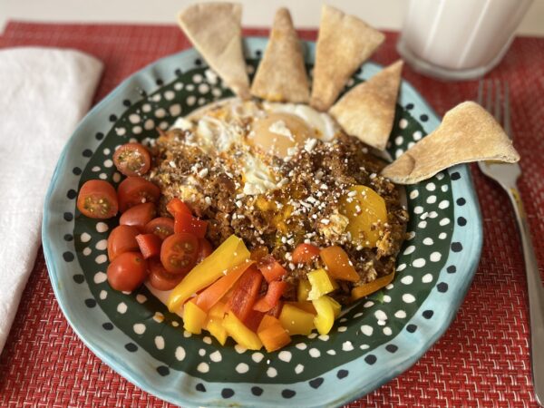 Cooked chorizo, eggs and salsa served with pita triangles, mixed pepper strips and cherry tomatoes
