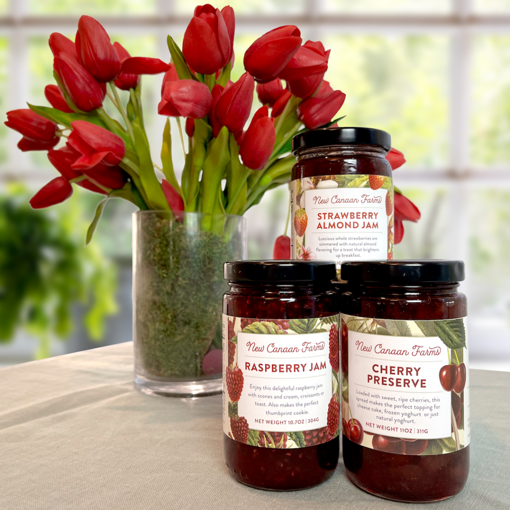 The three red jams that are in the New Canaan Farms Valentine Gift Box - Cherry Preserves, Raspberry Jam and Strawberry Almond Jam