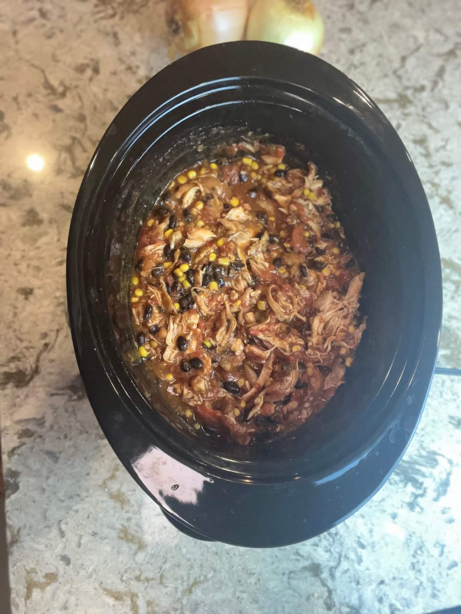 Cooked New Canaan Farms Gameday Chicken in a slow cooker