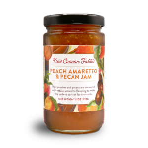 A jar of New Canaan Farms of Peach Amaretto Pecan Jam