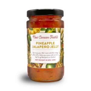 A jar of New Canaan Farms Pineapple Jalapeño Jelly