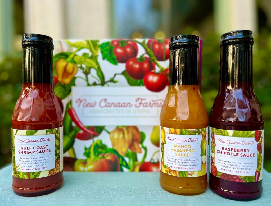 Three favorite New Canaan Farms sauces with their vegetable-inspired gift box; Gulf Coast Shrimp Sauce, Mango Habanero Sauce and Raspberry Chipotle Sauce