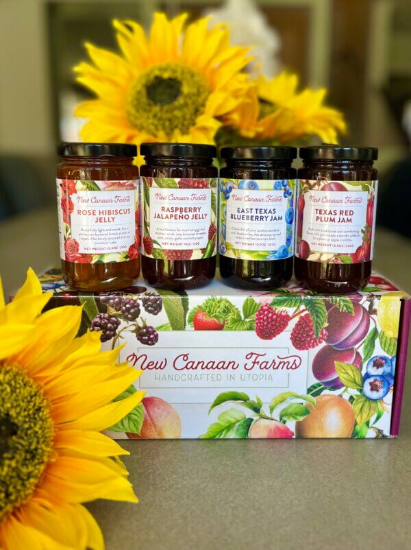 Summer fruits collection of jams in a lovely New Canaan Farms gift box; East Texas Blueberry jam, Rose Hibiscus Jelly, Raspberry Jalapeño Jelly and Texas red Plum Jam