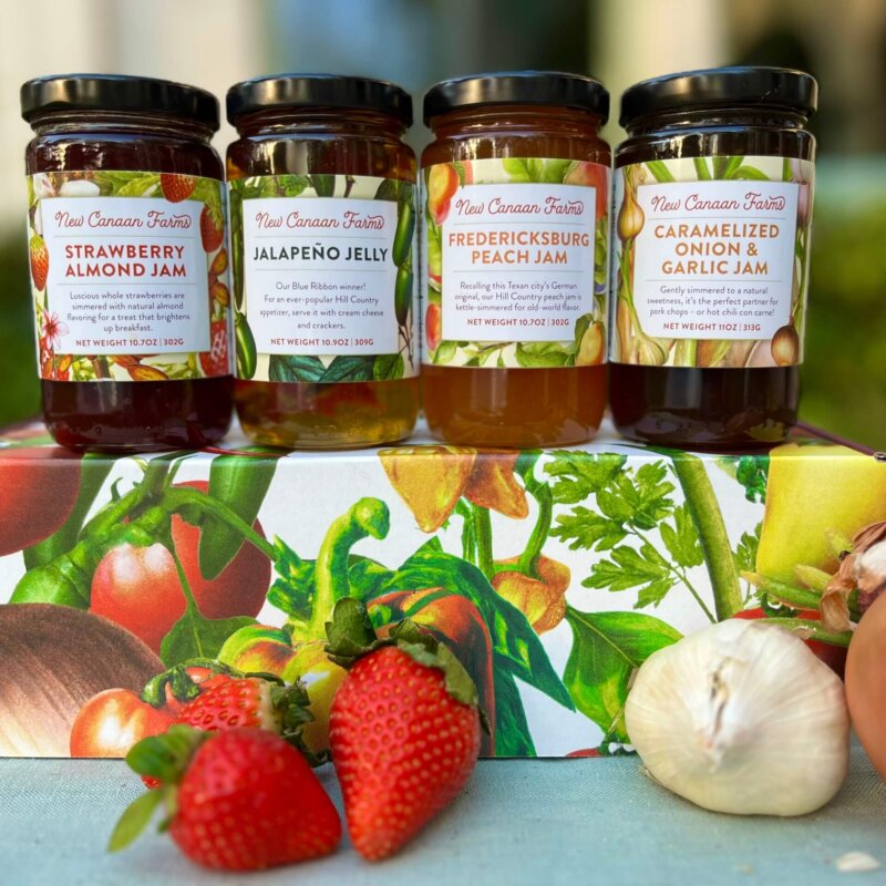 Four New Canaan Farms sweet and savory jams on our beautiful savory gift box; Strawberry Almond Jam, Fredericksburg Peach Jam, Jalapeño Jelly and Caramelized Onion and Garlic Jam