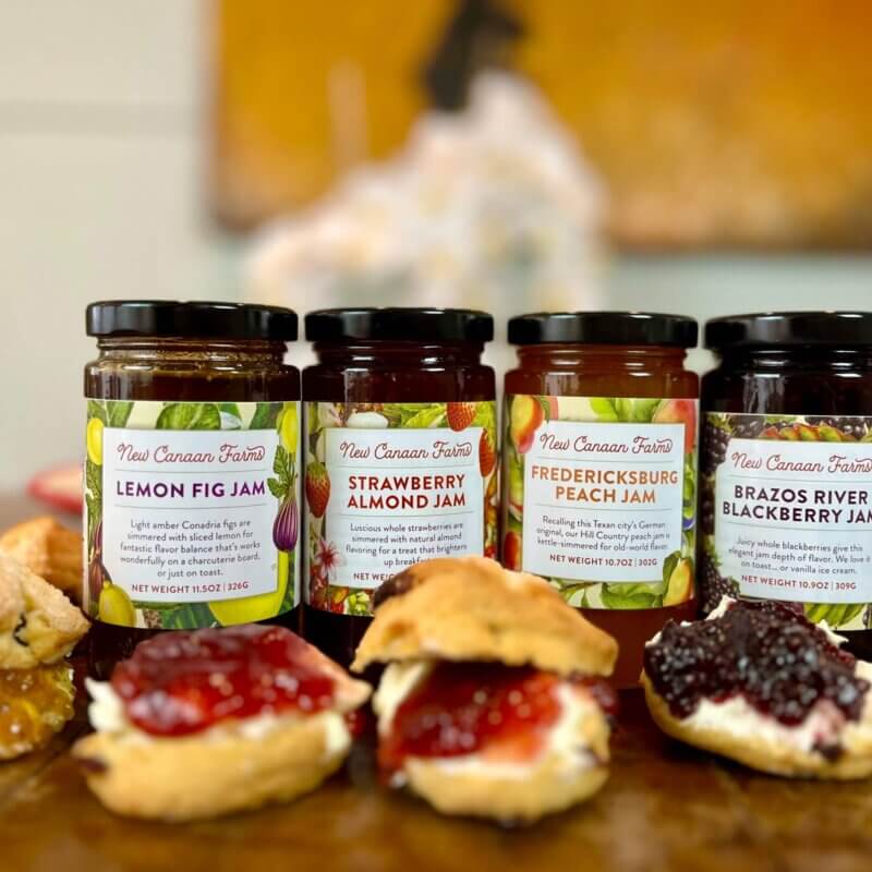 A selection of New Canaan Farm's sweet jam customer favorites: lemon fig, strawberry almond, Fredericksburg peach and Brazos River blackberry