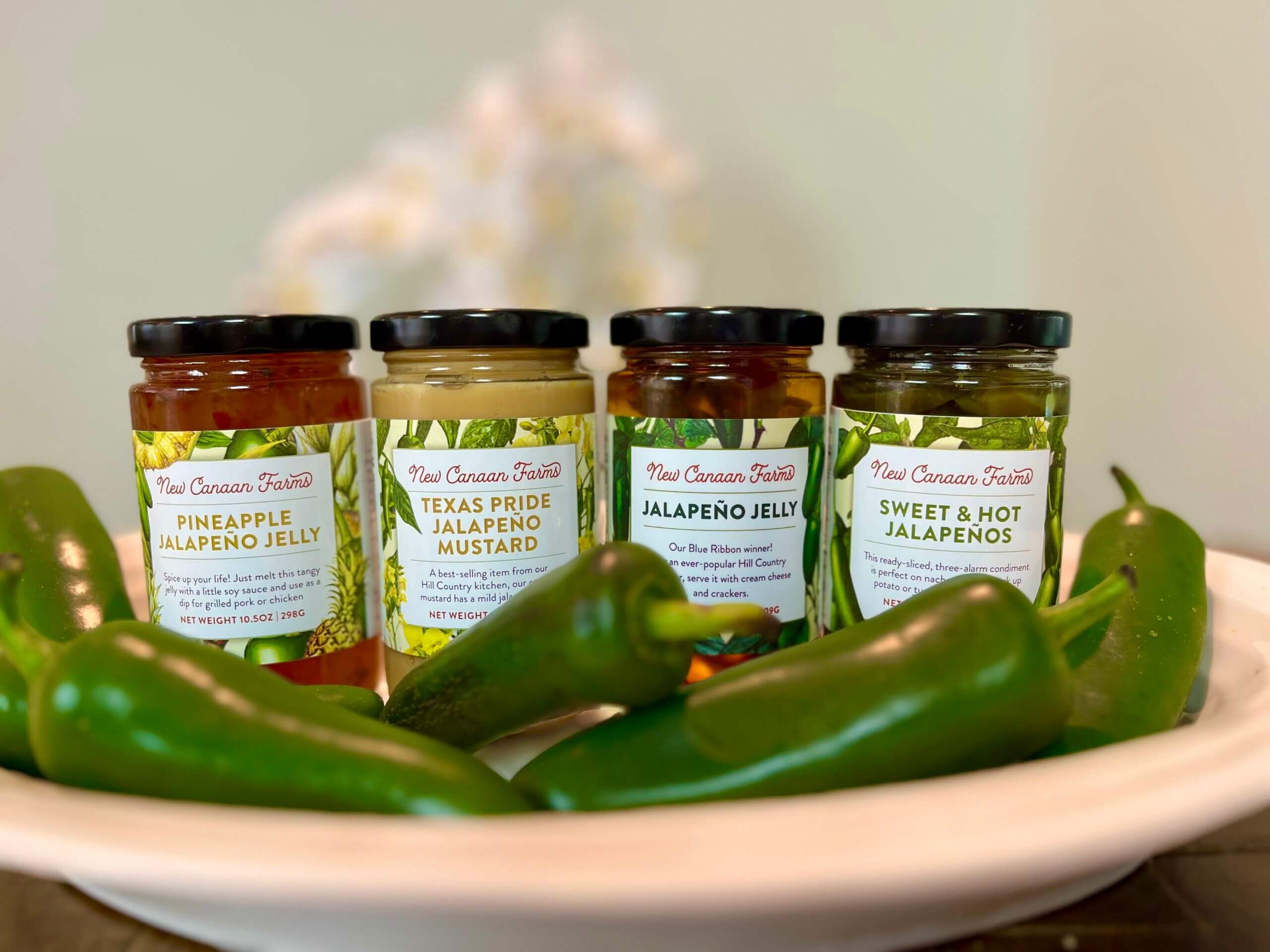 A collection of New Canaan Farms products that contain jalapeños
