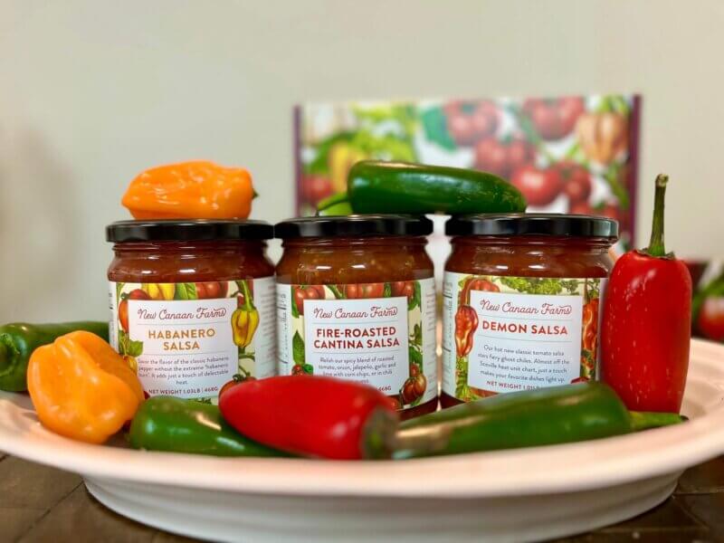 Three spicy New Canaan Farms salsas, Fire-Roasted Cantina, Habanero and the super hot Demon - surrounded with chilis