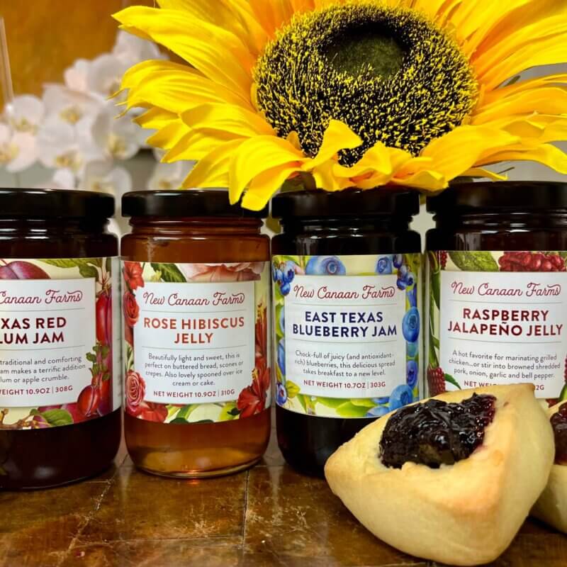A collection of four New Canaan Farms summer-fruits jams; blueberry, raspberry jalapeño, rose hibiscus and red plum jams