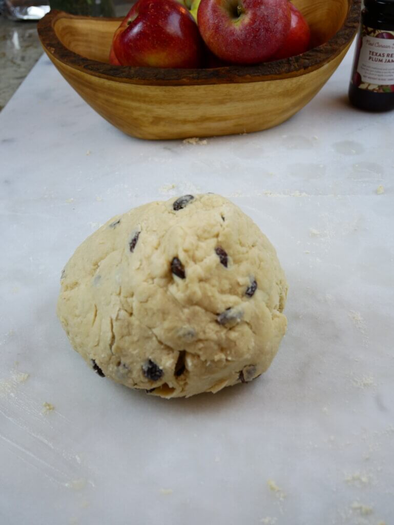 A ball of Irish soda bread sweet dough with raisins