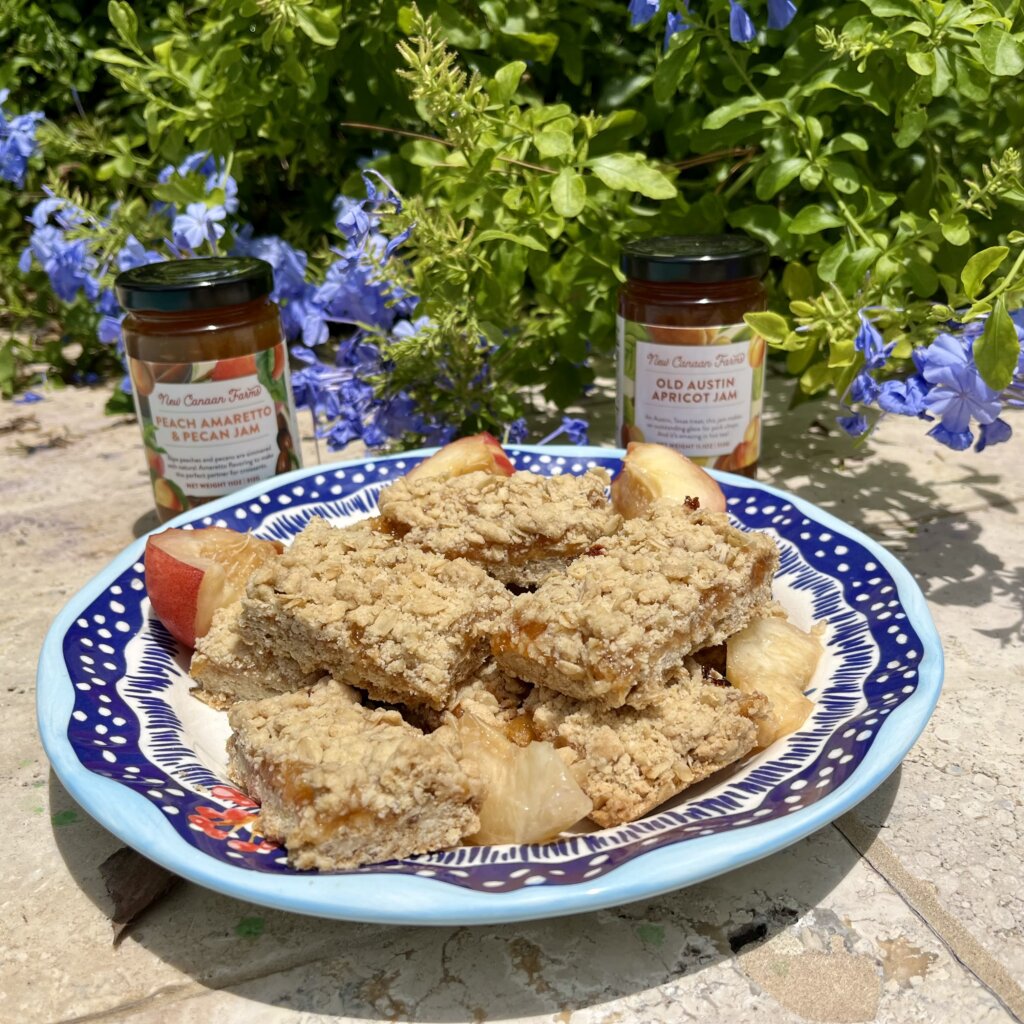 A plate of oat jam slices, made with New Canaan Farms Old Austin Apricot Jam, and Peach Amaretto & Pecan Jam