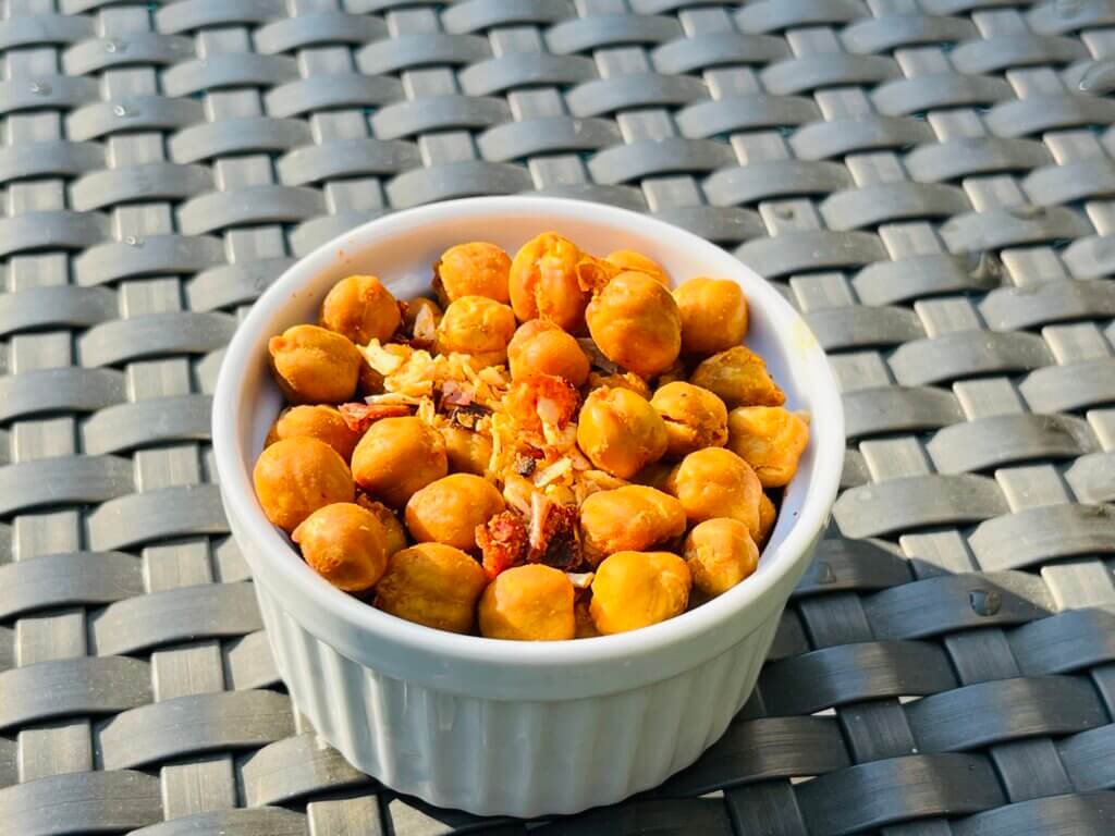 A small white bowl contained roasted Cajun Chickpeas