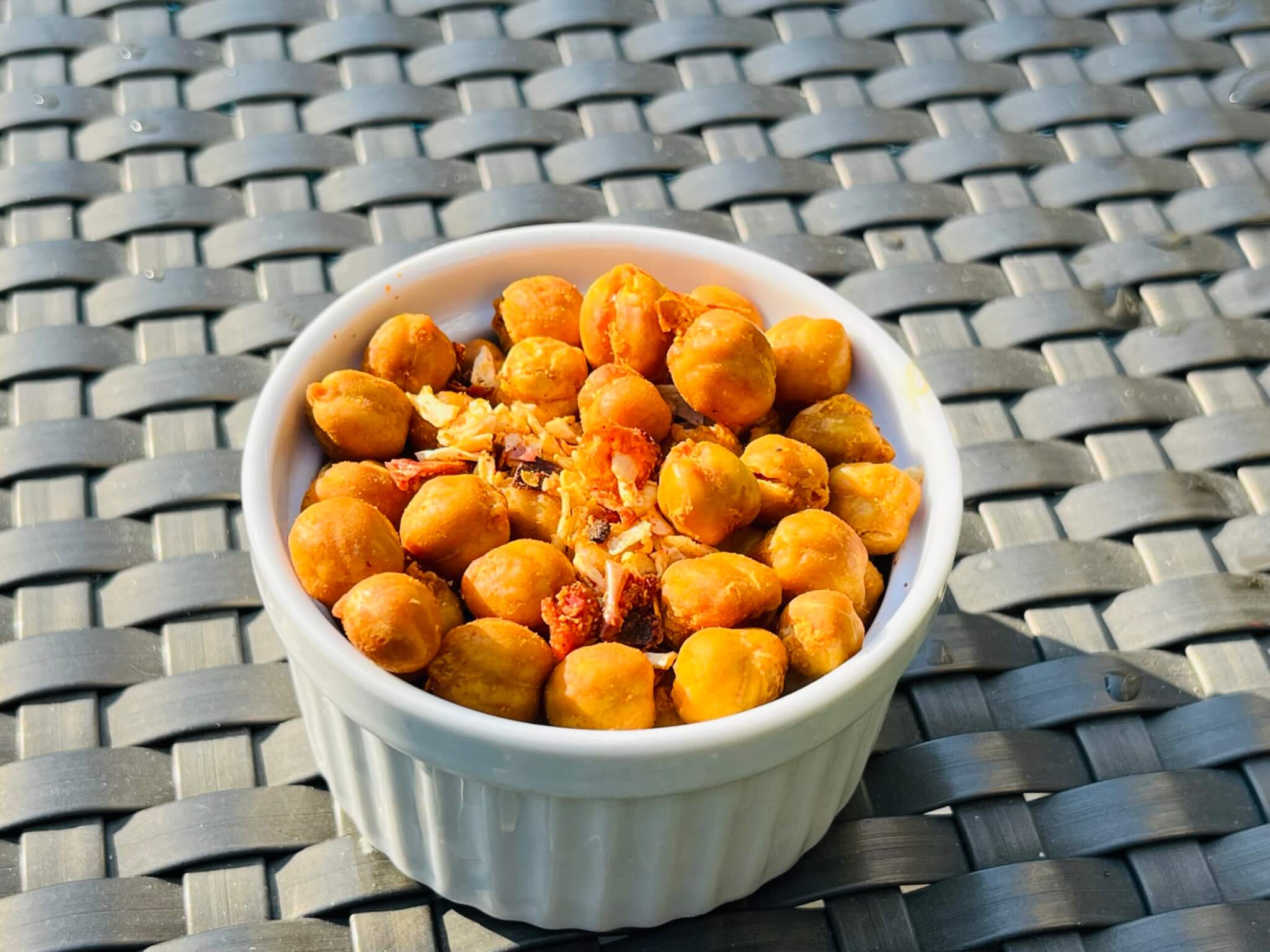 A small white bowl contained roasted Cajun Chickpeas