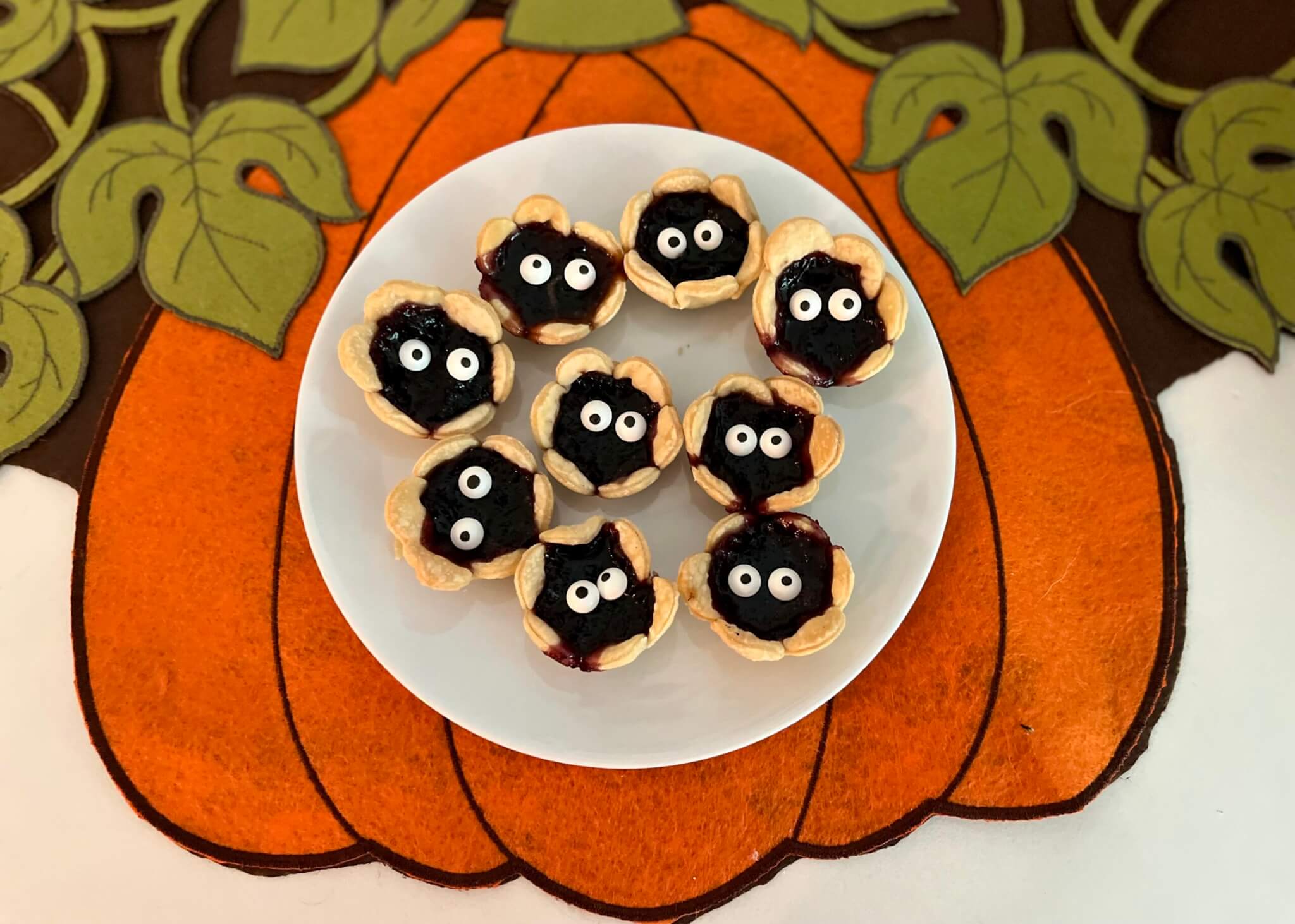 A white plate with Monster Jam Tarts, made with New Canaan Farms Blueberry Jam and spooky edible eyes