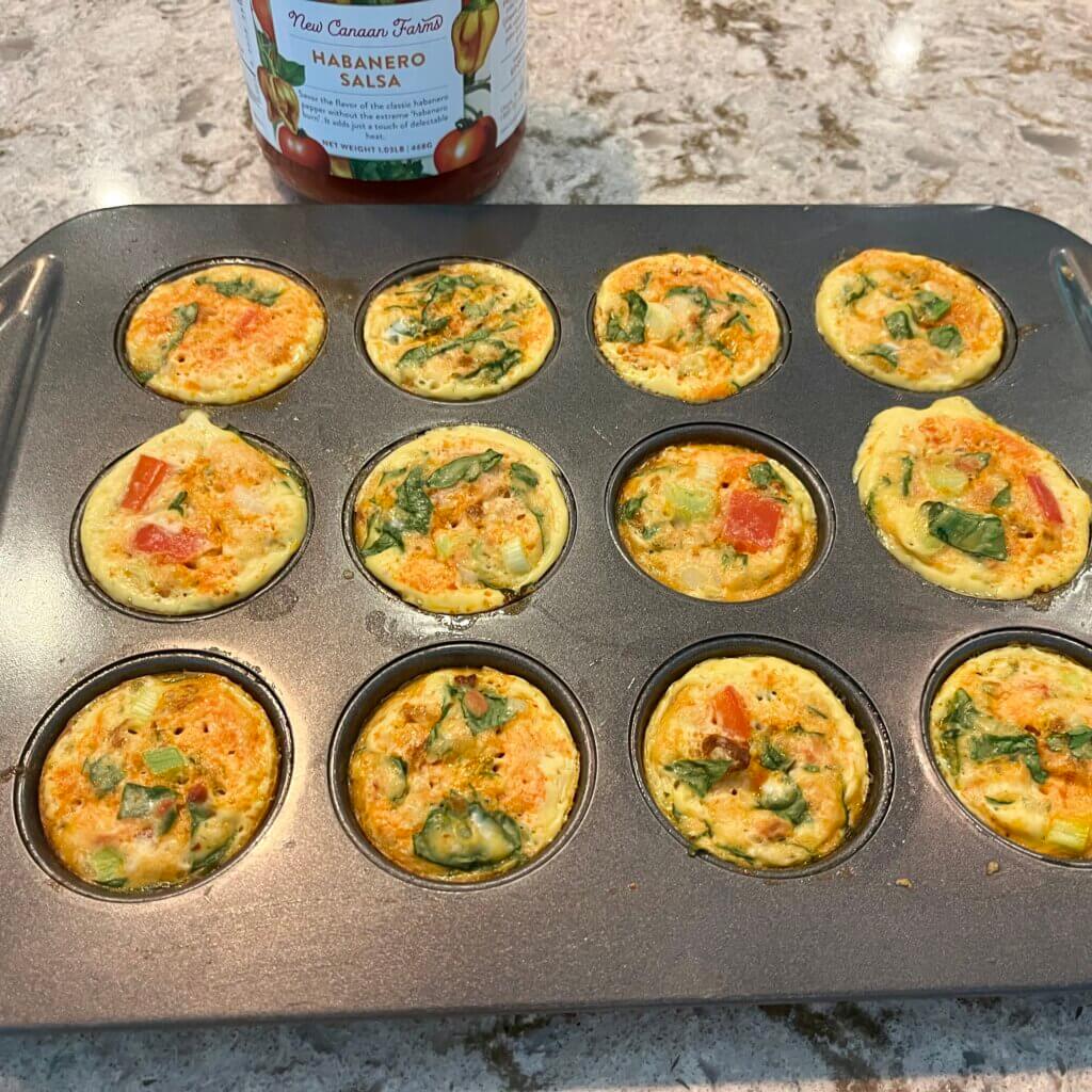Cooked egg muffins in a muffin pan