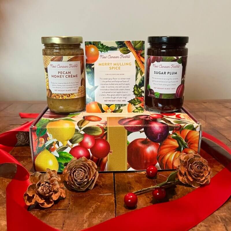 A New Canaan Farms seasonal gift box containing Pecan Sugar Crème, Sugar Plum jam and Merry Mulling Spice Mix