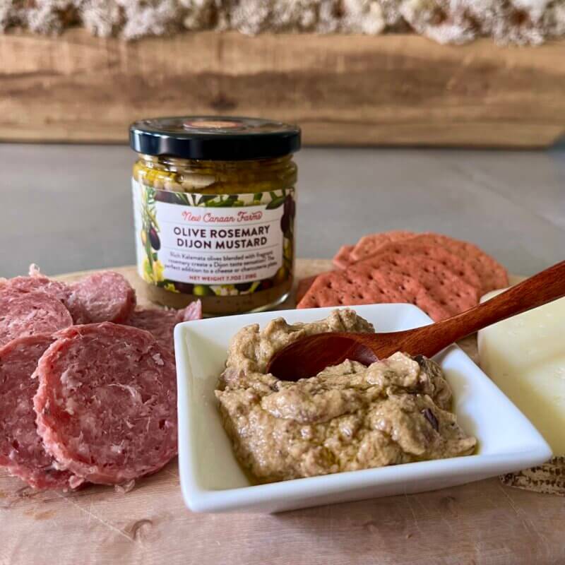 New Canaan Farms OliveRosemary Mustard, served with saucisson and manchego cheese