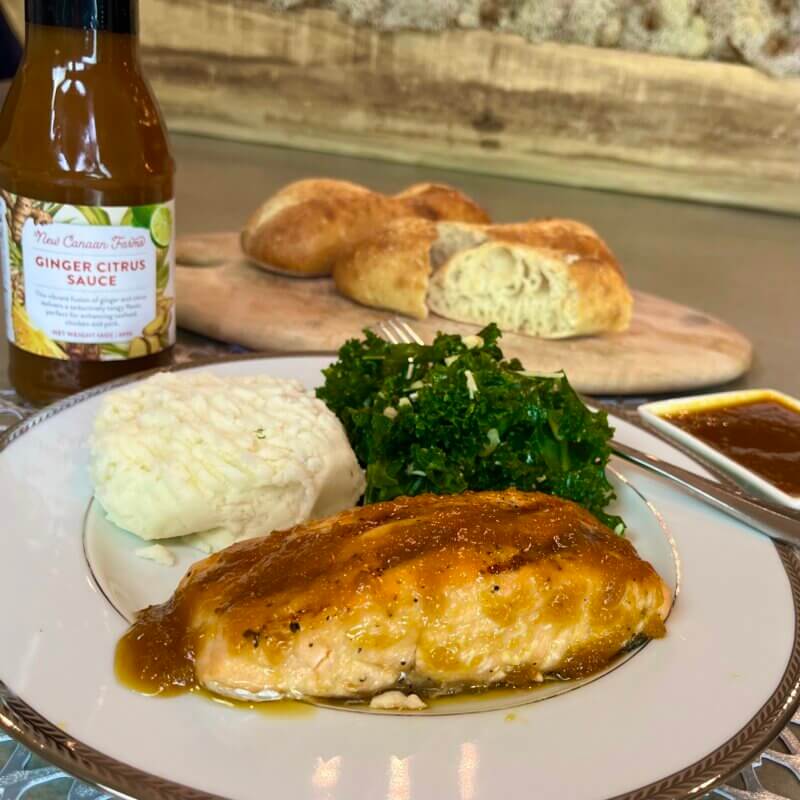 A plate of Ginger Citrus grilled salmon with mashed potato and broccolini