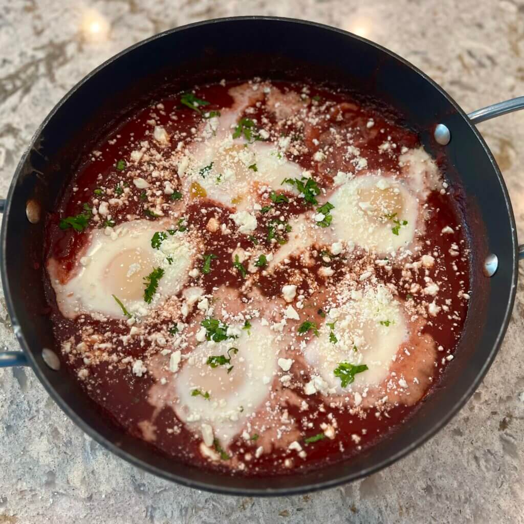 Warm baked eggs in New Canaan Farms Pedernales Picante Sauce