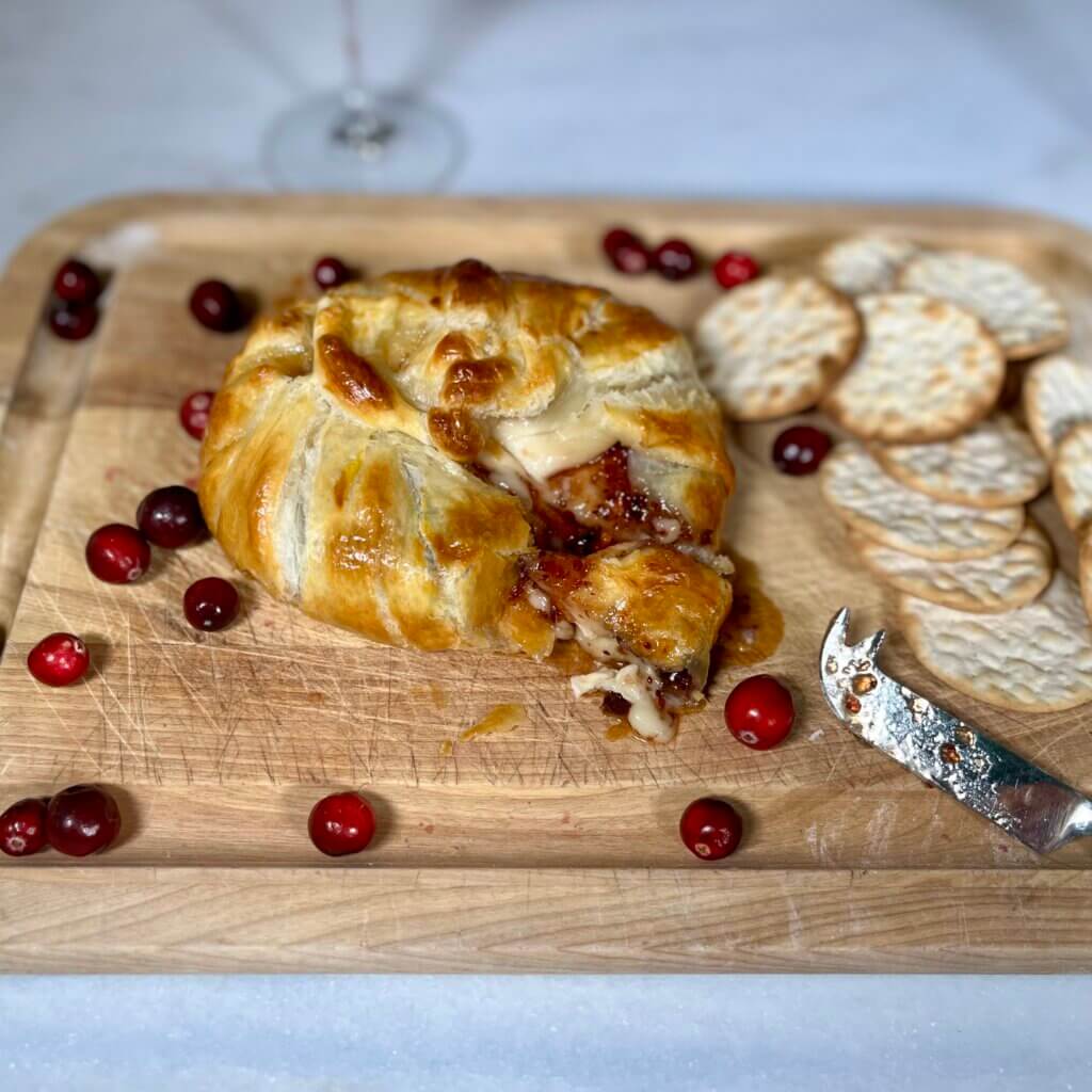 Baked Brie in puff pastry with New Canaan farms Cranberry Pepper Relish inside